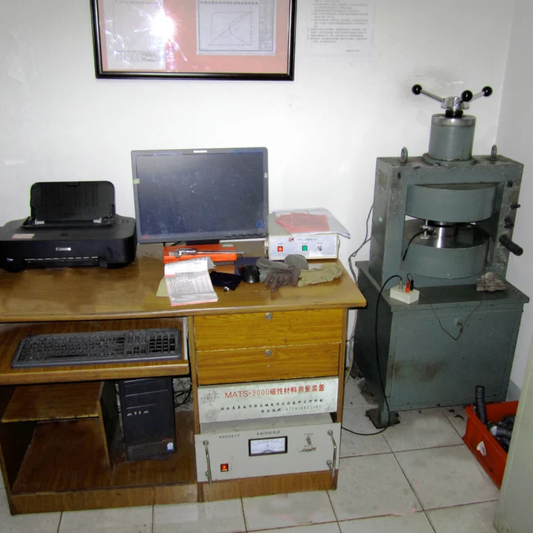 Magnetic material measurement system with an electromagnet test fixture and computer workstation.